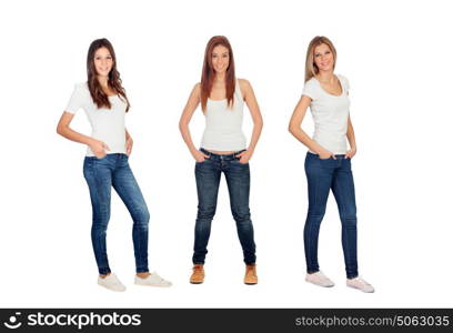 Full portrait of three casual girls with jeans and white tshirts isolated