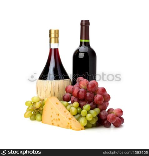 Full red wine bottles and grapes isolated on white background