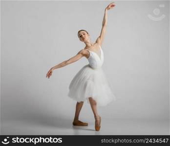 full shot ballerina wearing beautiful white dress