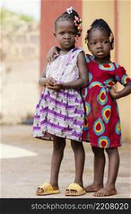 full shot cute african girls posing outdoors