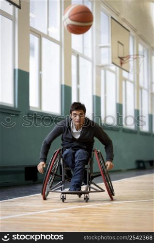 full shot disabled man going after ball