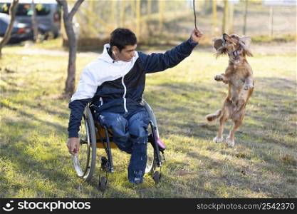 full shot disabled man playing with dog