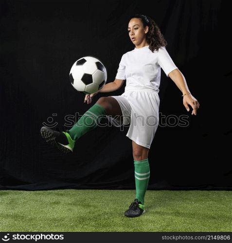 full shot female playing football