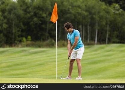 full shot fit adult man playing golf