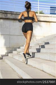 full shot fit woman running stairs