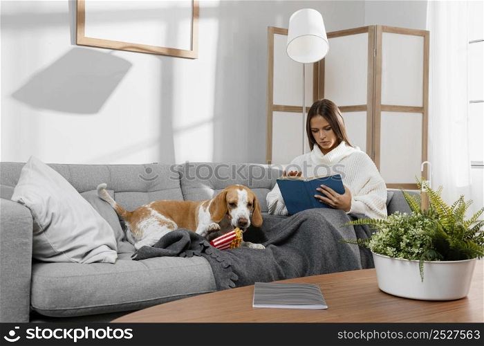 full shot girl couch with dog