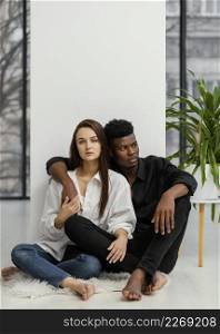 full shot interracial couple posing