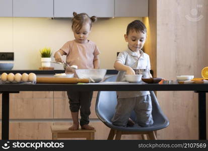 full shot kids preparing meal together