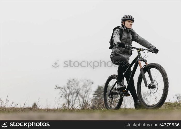 full shot man riding bike