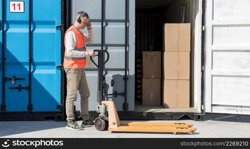 full shot man with pallet truck