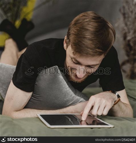 full shot man with tablet