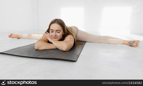 full shot relaxed woman mat