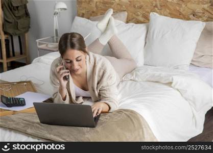full shot smiley woman working bed