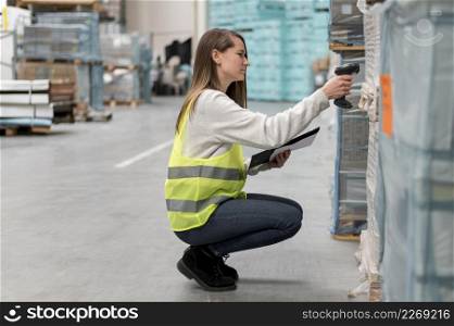 full shot woman scanning package
