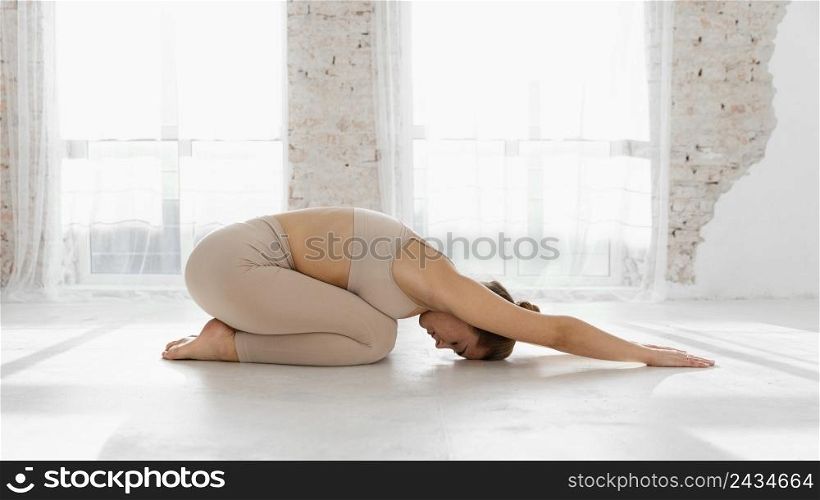 full shot woman stretching