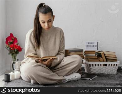 full shot woman with books tulips