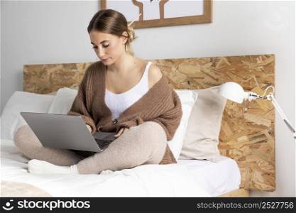 full shot woman working bed