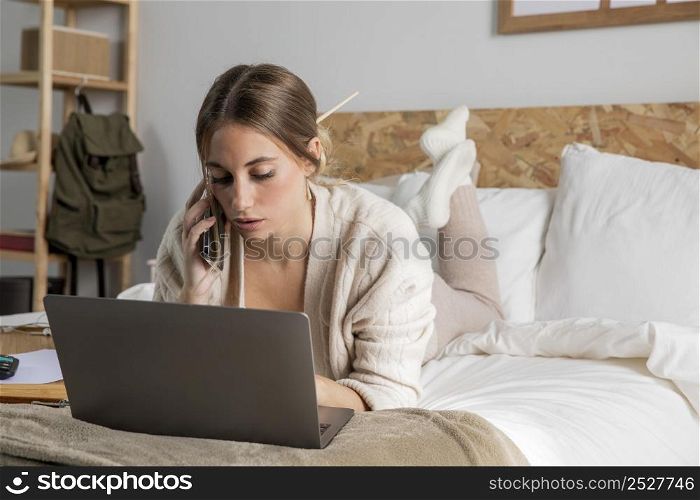 full shot woman working bed 3