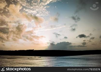 full spectrum of colors at sunset over the coastline on cornwall, uk