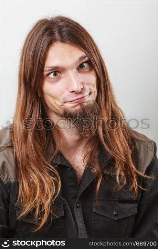 Fun and positivity. Funny man portrait. Face expression grimacing.. Guy making funny face