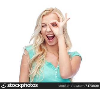 fun, emotions, expressions and people concept - smiling young woman or teenage girl making ok hand gesture