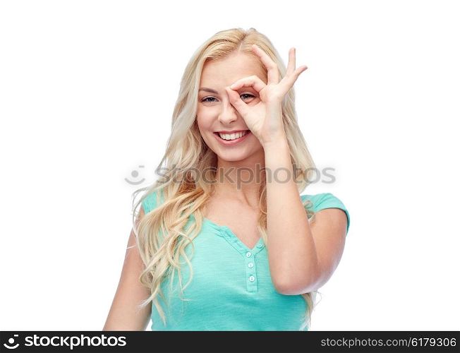 fun, emotions, expressions and people concept - smiling young woman or teenage girl making ok hand gesture