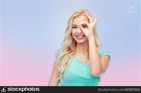 fun, emotions, expressions and people concept - smiling young woman or teenage girl making ok hand gesture over rose quartz and serenity gradient background
