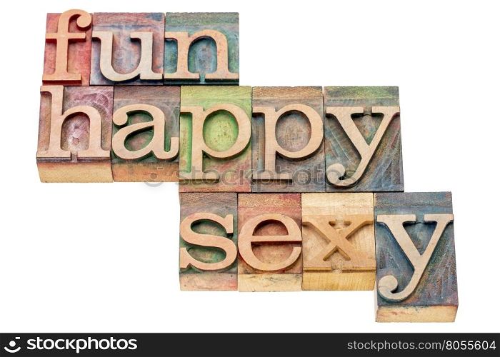 fun, happy and sexy - isolated word abstract in letterpress wood type printing blocks stained by color inks