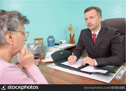 funeral director with elderly woman