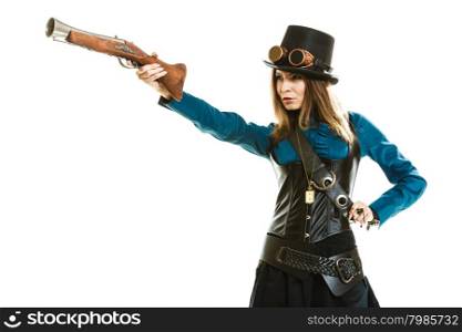 Funky girl in steampunk style.. Young steampunk islolated girl on white wearing fancy hat. Fantasy old fashion with stylish topper goggle and gun aiming.