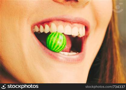 Funky people concept. Attractive girl chewing gum. Young woman has beautiful smile and white teeth. . Attractive girl chewing gum.