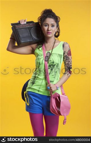 Funky woman listening to cassette player