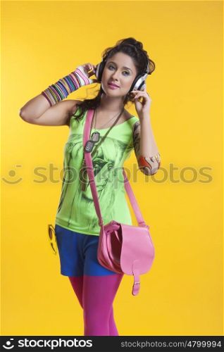 Funky young woman listening to music