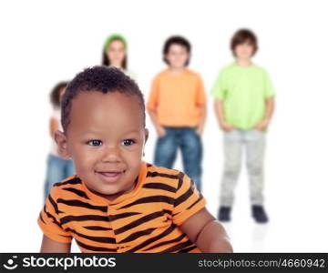 Funny afroamerican baby with other children unfocused of background