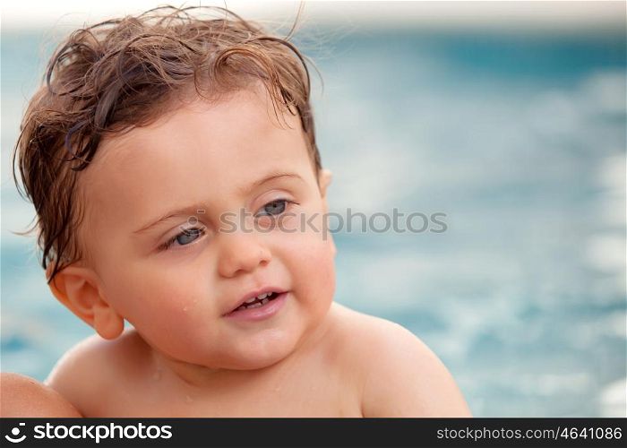Funny baby cooling off in the pool