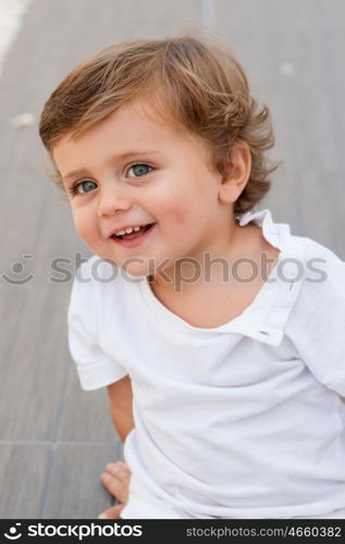 Funny baby one year with white t-shirt outdoor