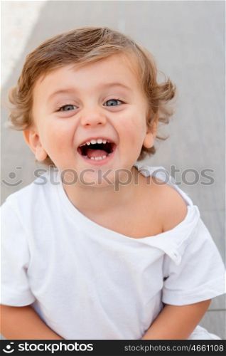 Funny baby one year with white t-shirt outdoor