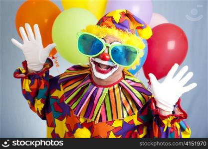 Funny birthday clown in hilarious oversized sunglasses.