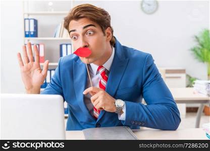 Funny bisinessman with fake lips in the office