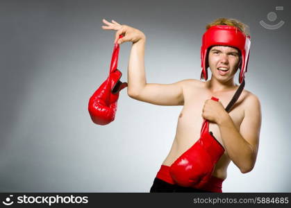 Funny boxer against dark background