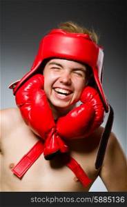 Funny boxer against dark background