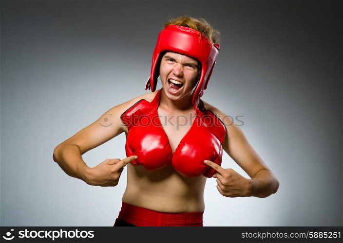 Funny boxer against dark background