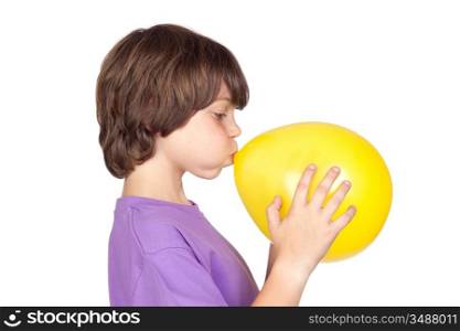 Funny boy blowing up a yellow balloon isolated on white background