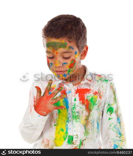 Funny boy with hands and face full of paint isolated on a white background