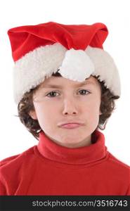 Funny boy with red hat of Christmas pulling a face on a over white background