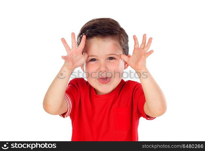Funny boy with red shirt making fun looking at camera. Funny boy with red shirt making fun looking at camera isolated on a white background