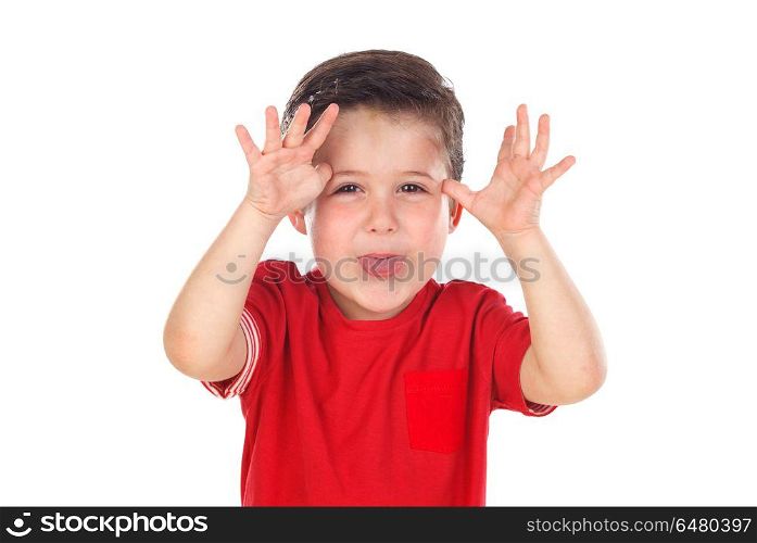 Funny boy with red shirt making fun looking at camera . Funny boy with red shirt making fun looking at camera isolated on a white background