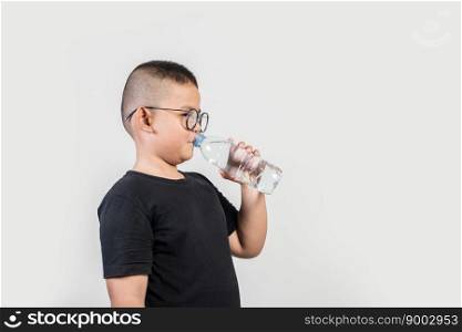 Funny boy with water bottle in studio shot