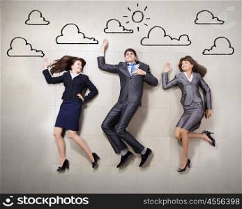 Funny business people. Funny businesspeople lying on floor and acting like running