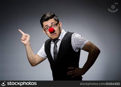 Funny businessman with clown nose